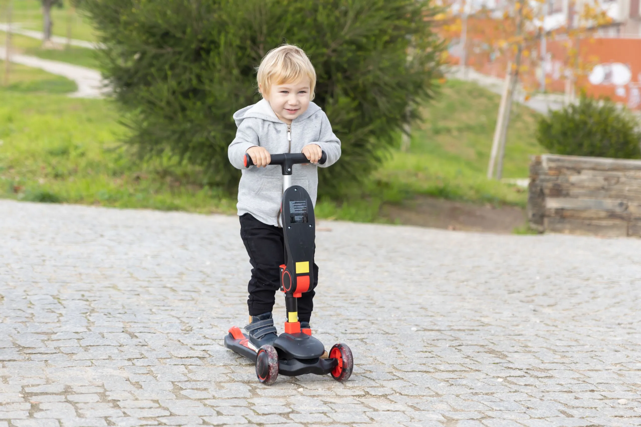 Kids Using Scooters Ride-On Toys vs Scooters: Ultimate Parent Guide - Bebeluxbaby